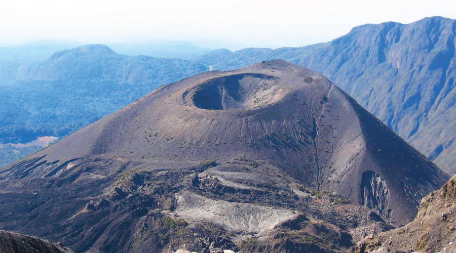 Arusha National Park - Lake Dreams: Adventurers conquering the summit of Mount Meru with panoramic views.