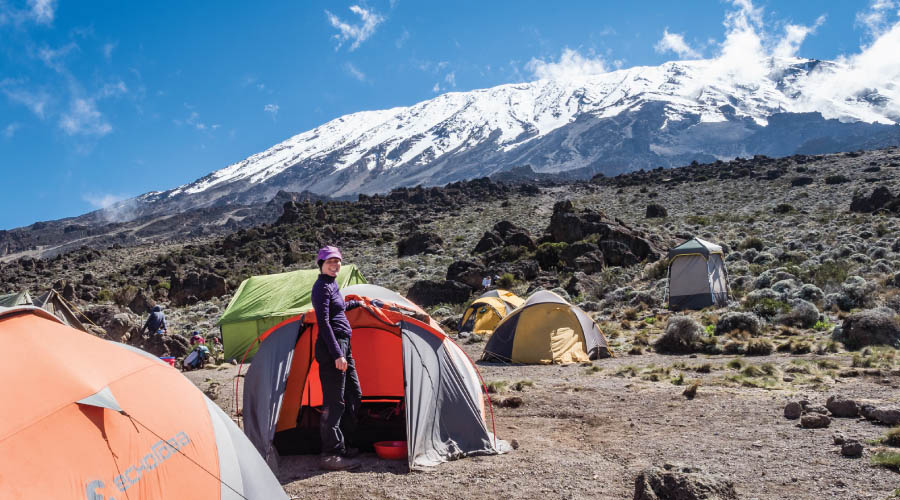 Marangu Route: Climbers celebrating at the highest point in Africa on Mount Kilimanjaro.