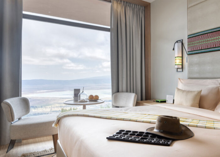 Cozy bedroom at Ngorongoro Lodge Meliá Collection offering premium crater accommodation